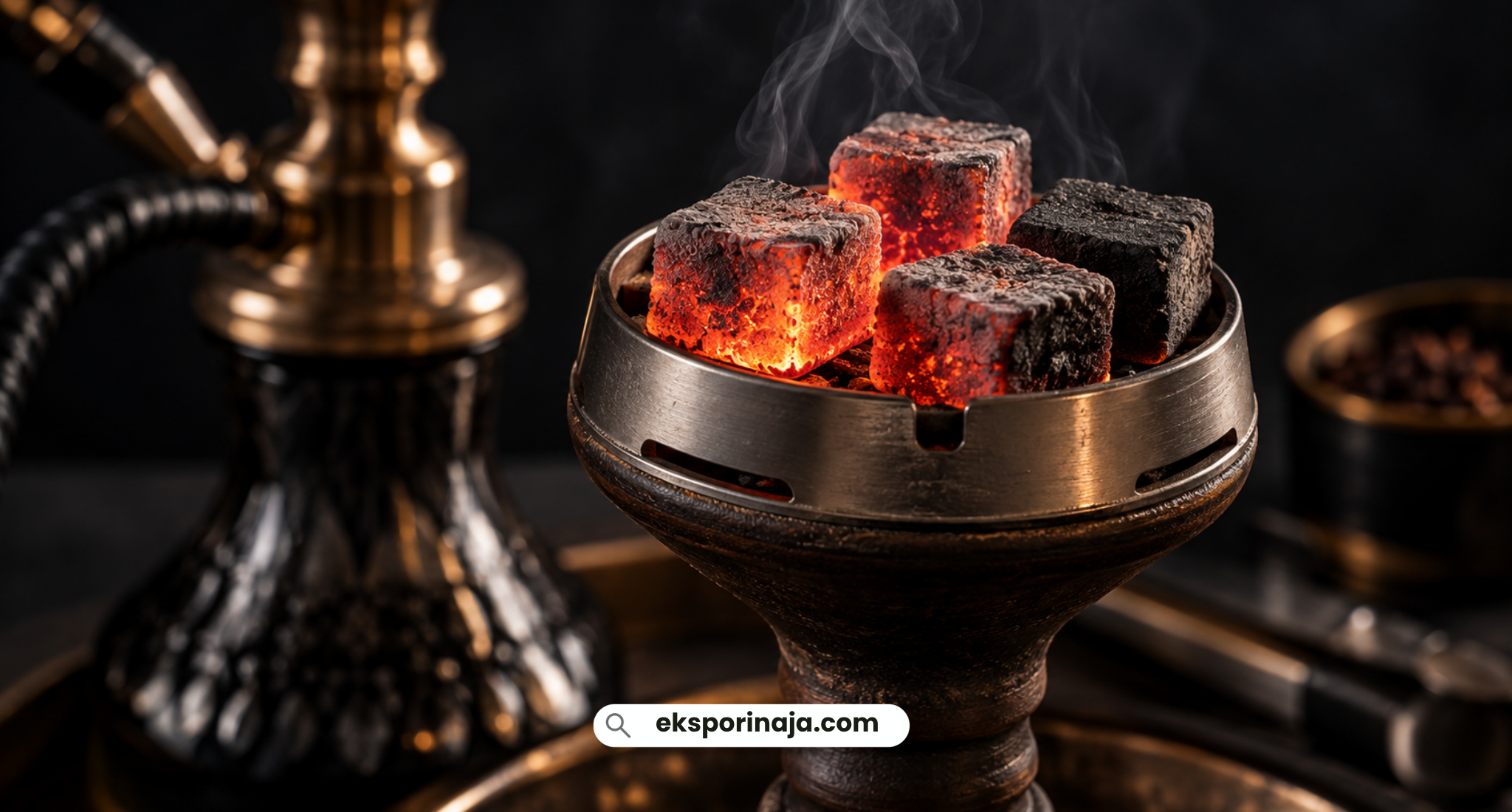 Glowing coconut shell charcoal briquettes placed on a shisha bowl, illustrating heat distribution and burning performance